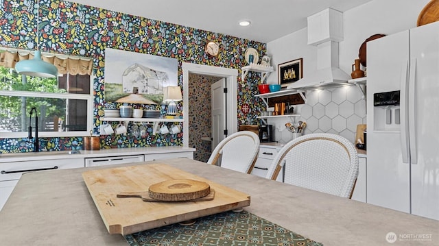 dining room with wallpapered walls