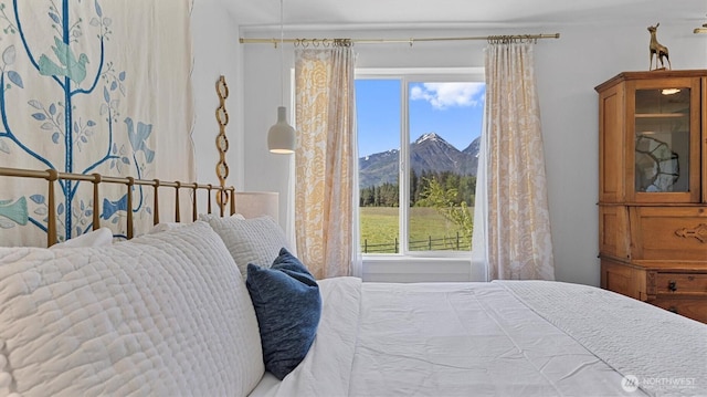 bedroom featuring a mountain view