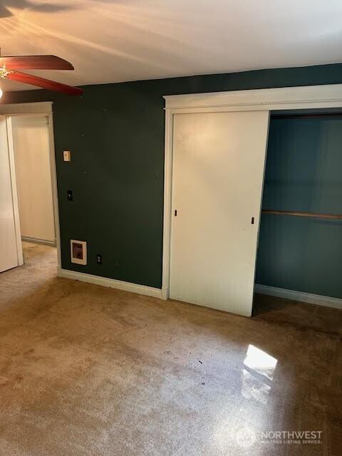 816 Sunrise Ln, Centralia, WA 98531 - unfurnished bedroom with a closet, carpet, and ceiling fan