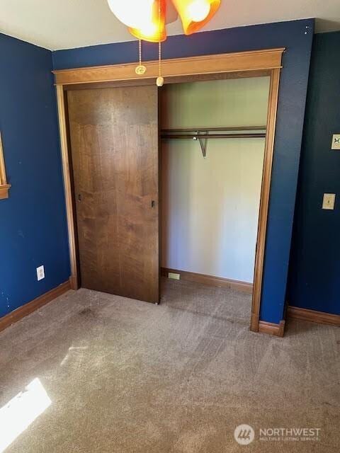 816 Sunrise Ln, Centralia, WA 98531 - unfurnished bedroom with a closet, carpet, and baseboards