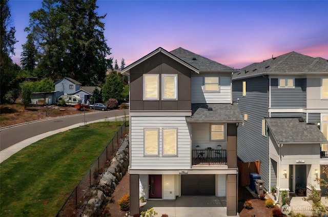 207 207th St SE Unit Eh49, Bothell, WA 98012 - view of front facade with roof with shingles, concrete driveway, and a garage