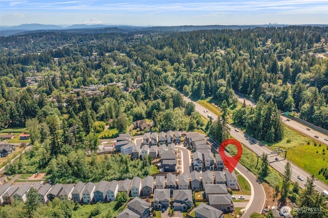 207 207th St SE Unit Eh49, Bothell, WA 98012 - aerial view of property and surrounding area featuring a forest and nearby suburban area