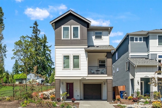 207 207th St SE Unit Eh49, Bothell, WA 98012 - view of front of home with an attached garage, driveway, and a balcony