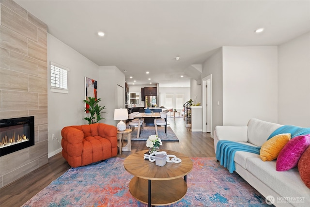 207 207th St SE Unit Eh49, Bothell, WA 98012 - living area featuring wood finished floors, a fireplace, recessed lighting, and baseboards