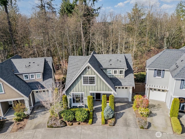 3723 218th Pl SE, Bothell, WA 98021 - view of front of property with board and batten siding, concrete driveway, and roof with shingles