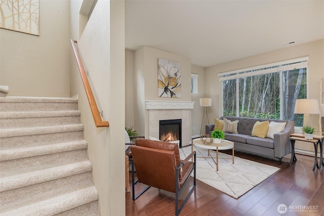 3723 218th Pl SE, Bothell, WA 98021 - living room featuring wood finished floors, a tile fireplace, and stairs