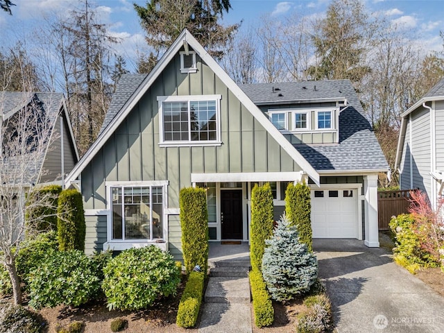 3723 218th Pl SE, Bothell, WA 98021 - view of front facade featuring board and batten siding, a shingled roof, asphalt driveway, fence, and an attached garage