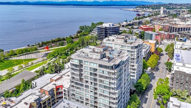 view of urban area featuring a water and mountain view