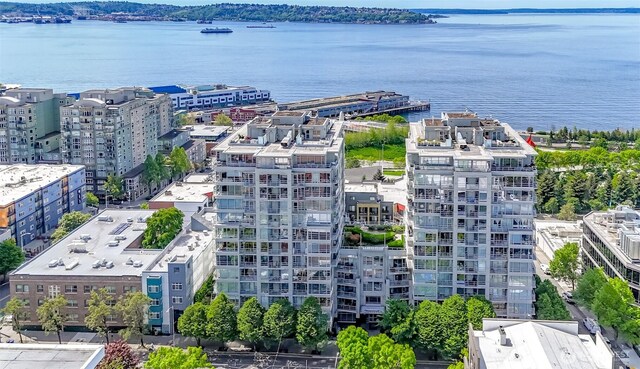bird's eye view of apartment complex / building and a nearby body of water