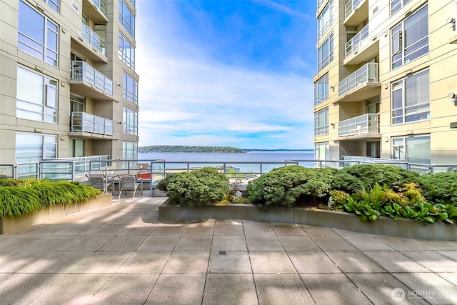 balcony featuring a water view