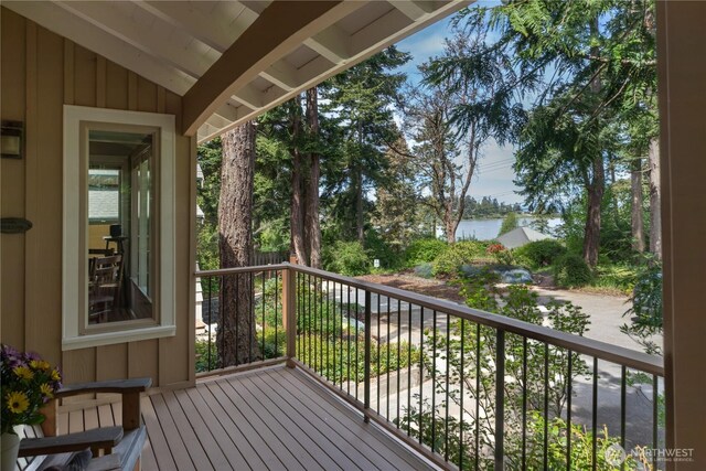 wooden deck with a water view