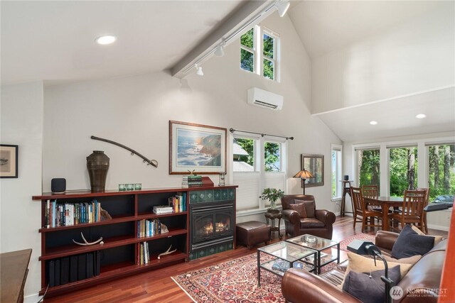 living area with a wall mounted air conditioner, lofted ceiling, wood finished floors, healthy amount of natural light, and recessed lighting