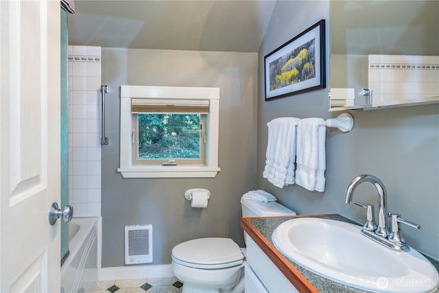 full bath featuring vanity, heating unit, toilet, and baseboards