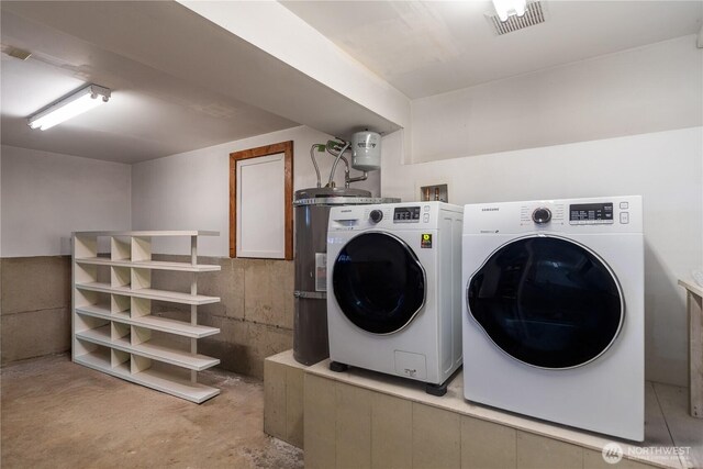 clothes washing area featuring washer and dryer