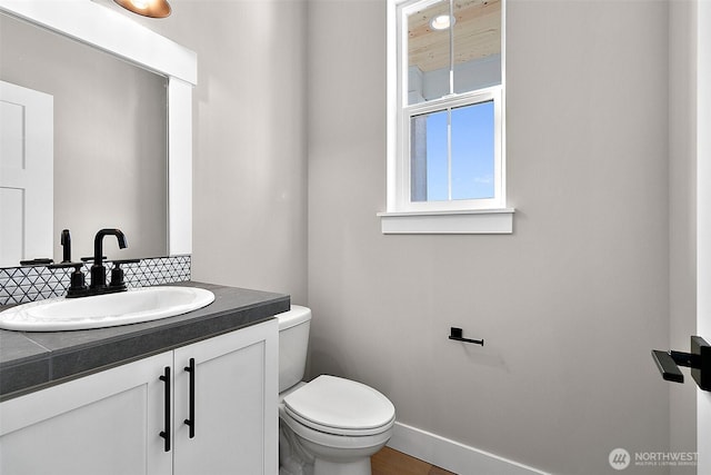 15709LOT12 SE 257th St, Covington, WA 98042 - half bath with decorative backsplash, toilet, vanity, and baseboards