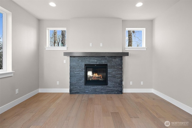 15709LOT12 SE 257th St, Covington, WA 98042 - detailed view of wood finished floors, a fireplace, recessed lighting, and baseboards