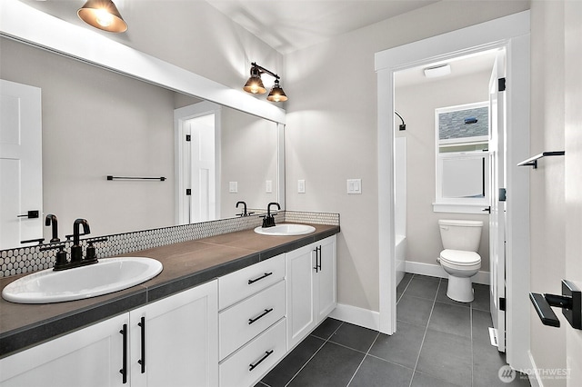 15709LOT12 SE 257th St, Covington, WA 98042 - full bath featuring tile patterned floors, double vanity, toilet,  shower combination, and baseboards