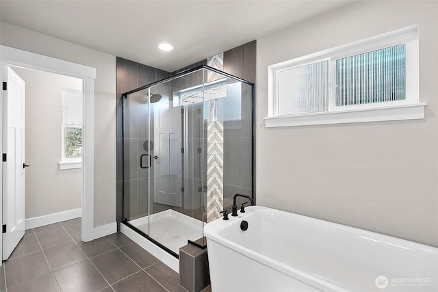 15709LOT12 SE 257th St, Covington, WA 98042 - bathroom featuring a soaking tub, tile patterned floors, a stall shower, baseboards, and recessed lighting