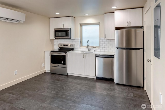 3325 Martin Luther King Jr Way S, Seattle, WA 98144 - kitchen with appliances with stainless steel finishes, an AC wall unit, light countertops, decorative backsplash, and white cabinets