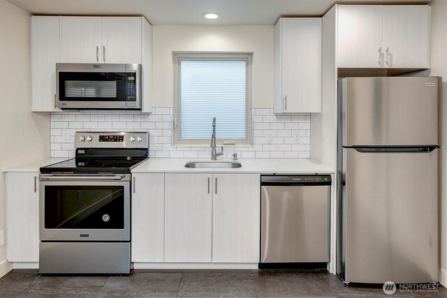 3325 Martin Luther King Jr Way S, Seattle, WA 98144 - kitchen featuring stainless steel appliances, a sink, light countertops, backsplash, and recessed lighting