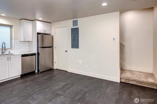 3325 Martin Luther King Jr Way S, Seattle, WA 98144 - kitchen featuring stainless steel appliances, electric panel, a sink, light countertops, and white cabinets