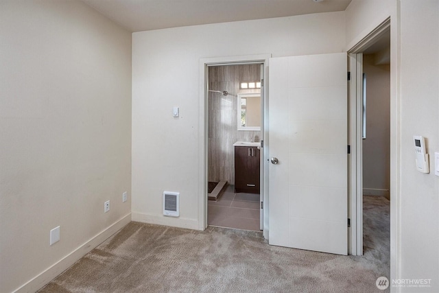 3325 Martin Luther King Jr Way S, Seattle, WA 98144 - unfurnished bedroom featuring carpet flooring, baseboards, and connected bathroom