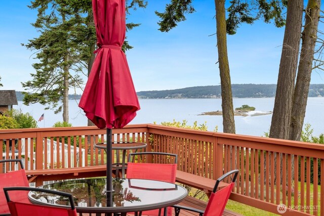 2967 Saratoga Rd, Langley, WA 98260 - wooden terrace with a water view and outdoor dining space
