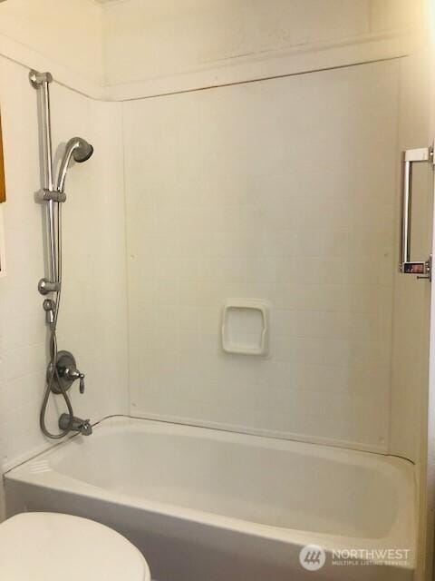 full bathroom featuring toilet and shower / tub combination