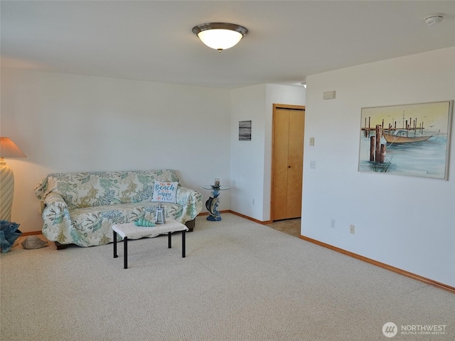 living room with carpet flooring and baseboards