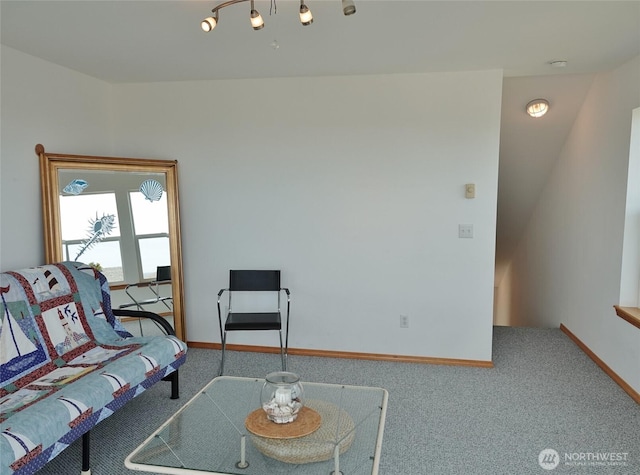 carpeted living room with baseboards