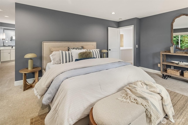 bedroom featuring light carpet, baseboards, and recessed lighting