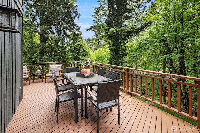 deck with outdoor dining area