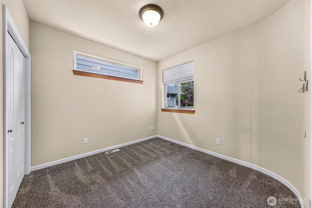 549 E Maberry Dr, Lynden, WA 98264 - unfurnished bedroom with dark colored carpet, baseboards, and a closet