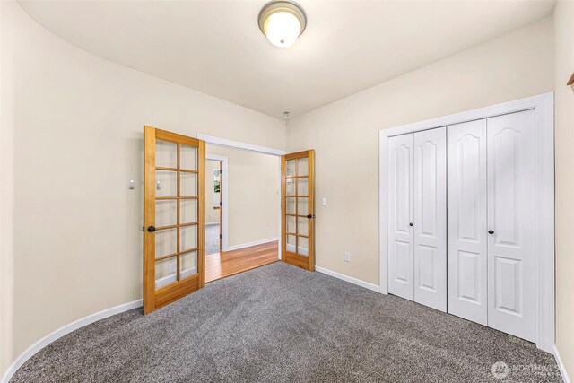 549 E Maberry Dr, Lynden, WA 98264 - carpeted bedroom with french doors, a closet, and baseboards