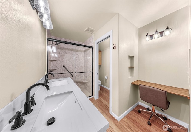 549 E Maberry Dr, Lynden, WA 98264 - full bath with a sink, toilet, wood finished floors, and baseboards