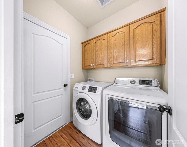 549 E Maberry Dr, Lynden, WA 98264 - laundry area with washing machine and dryer, cabinet space, and wood finished floors