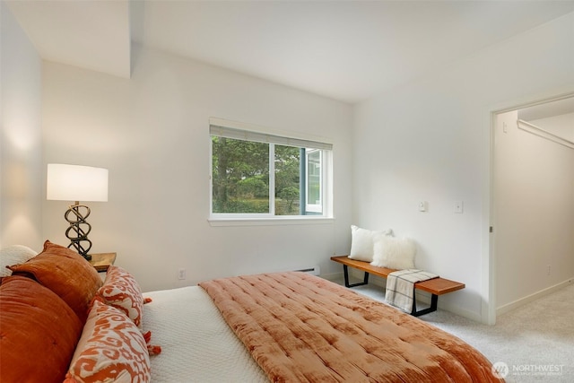 carpeted bedroom with baseboards