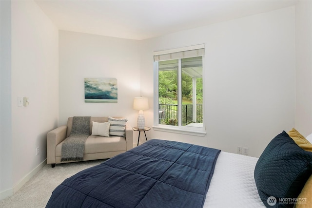 carpeted bedroom with baseboards