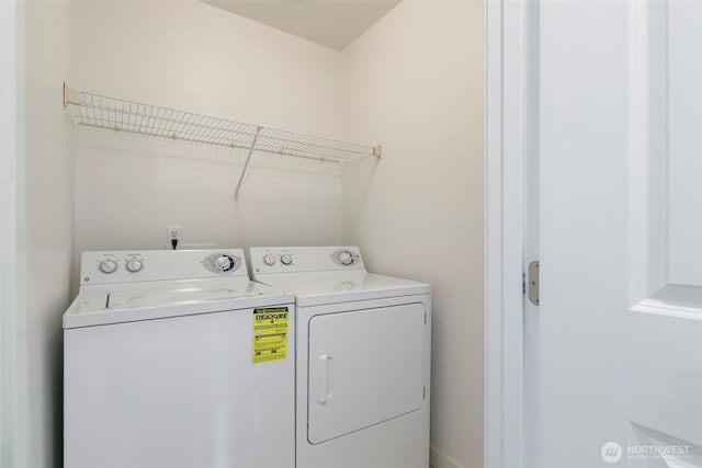 washroom featuring washing machine and dryer