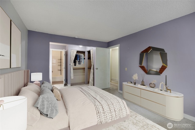 13739 15th Ave NE Unit B9, Seattle, WA 98125 - bedroom featuring baseboards, light colored carpet, ensuite bath, and a textured ceiling