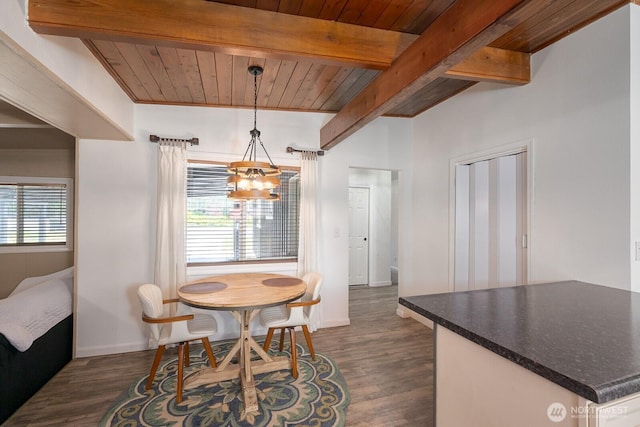2008 S Belair Dr, Moses Lake, WA 98837 - dining room featuring a chandelier, beamed ceiling, dark wood finished floors, wooden ceiling, and baseboards