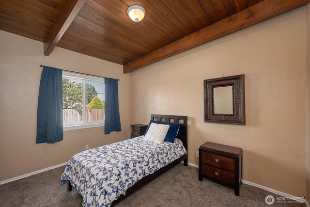 2008 S Belair Dr, Moses Lake, WA 98837 - carpeted bedroom featuring beam ceiling, wooden ceiling, and baseboards
