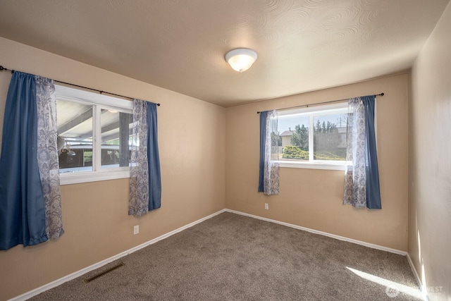 2008 S Belair Dr, Moses Lake, WA 98837 - unfurnished room with baseboards and carpet flooring