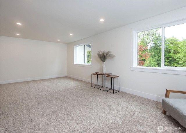 unfurnished room featuring recessed lighting, carpet, and baseboards
