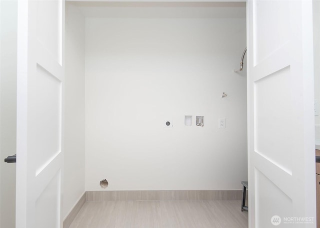 laundry room featuring washer hookup, electric dryer hookup, and baseboards