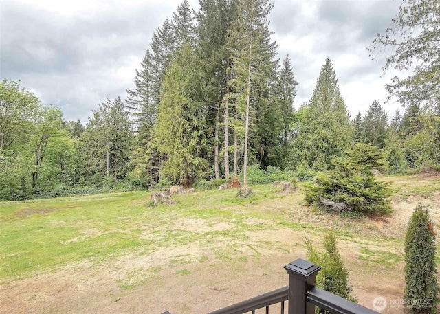 view of yard with a wooded view
