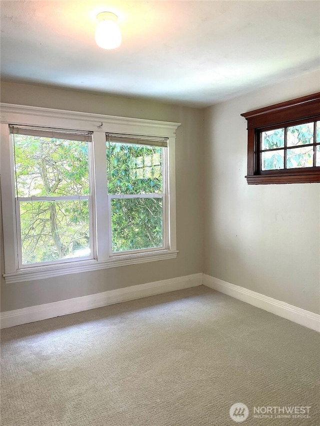 1808 E Harrison St, Seattle, WA 98112 - spare room featuring baseboards and carpet