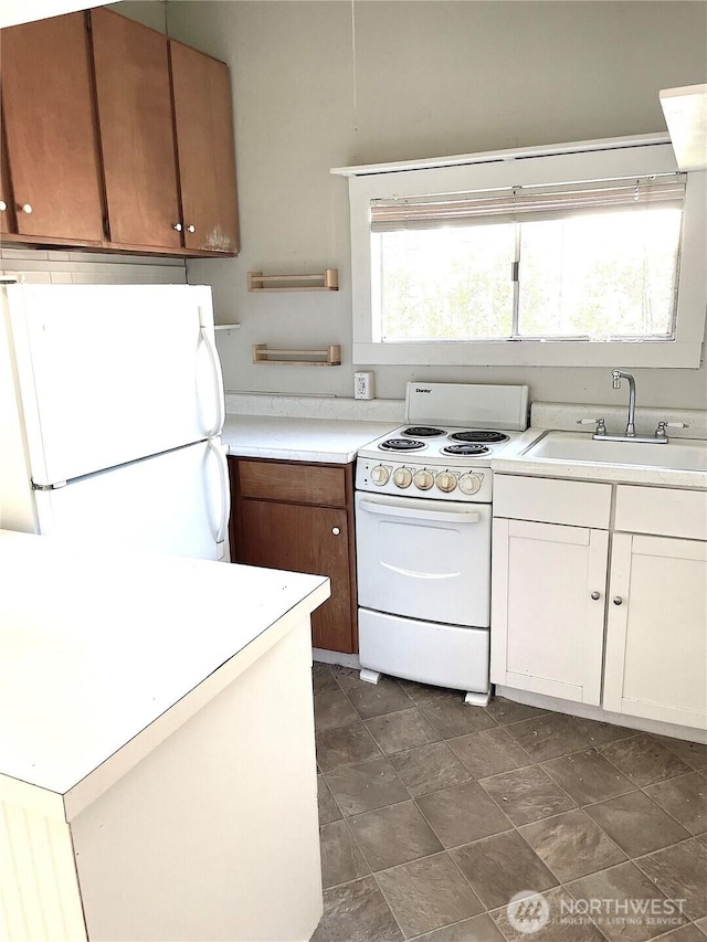 1808 E Harrison St, Seattle, WA 98112 - kitchen with white appliances, a sink, and light countertops