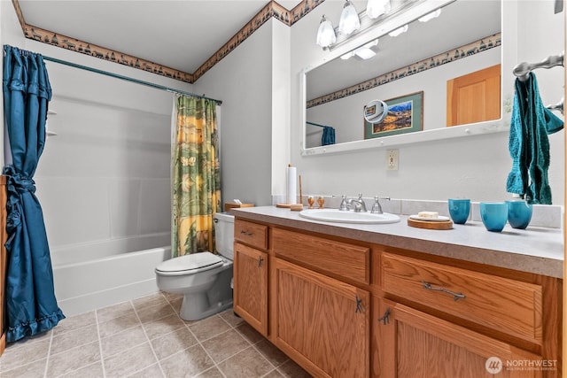 bathroom featuring toilet, vanity, shower / tub combo with curtain, and tile patterned floors