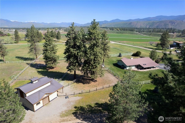 view of rural area featuring a mountainous background and a pastoral area